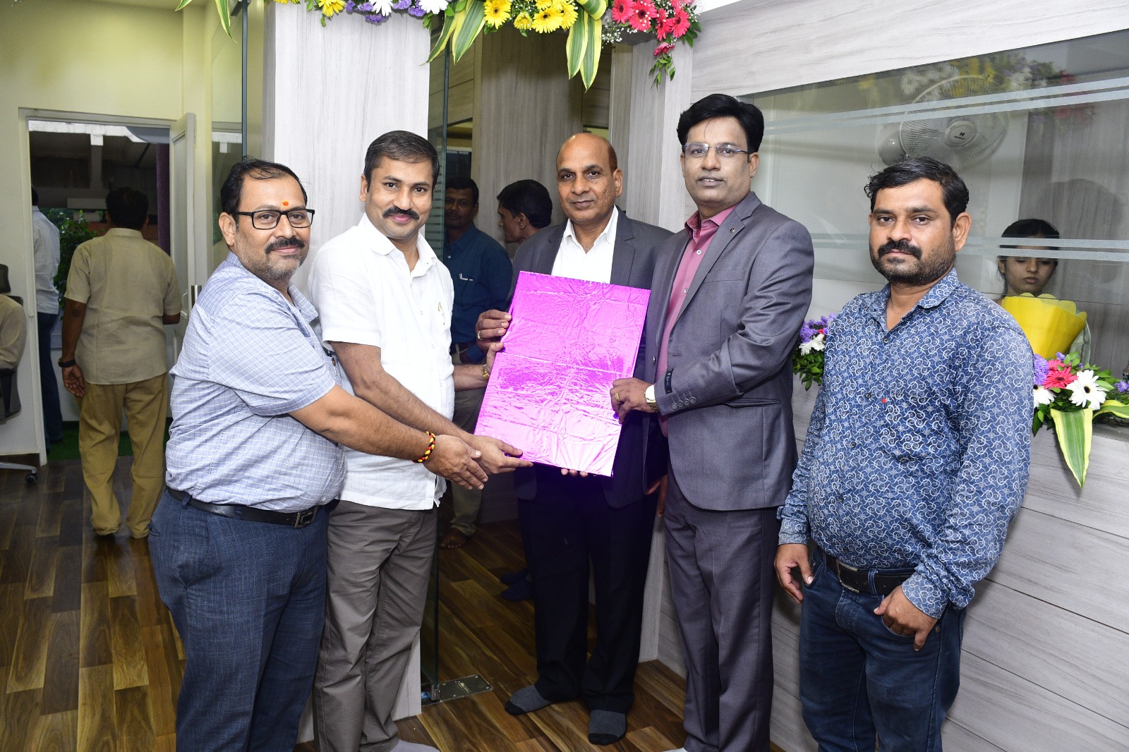 Property document handover ceremony at Tirumauli Developers